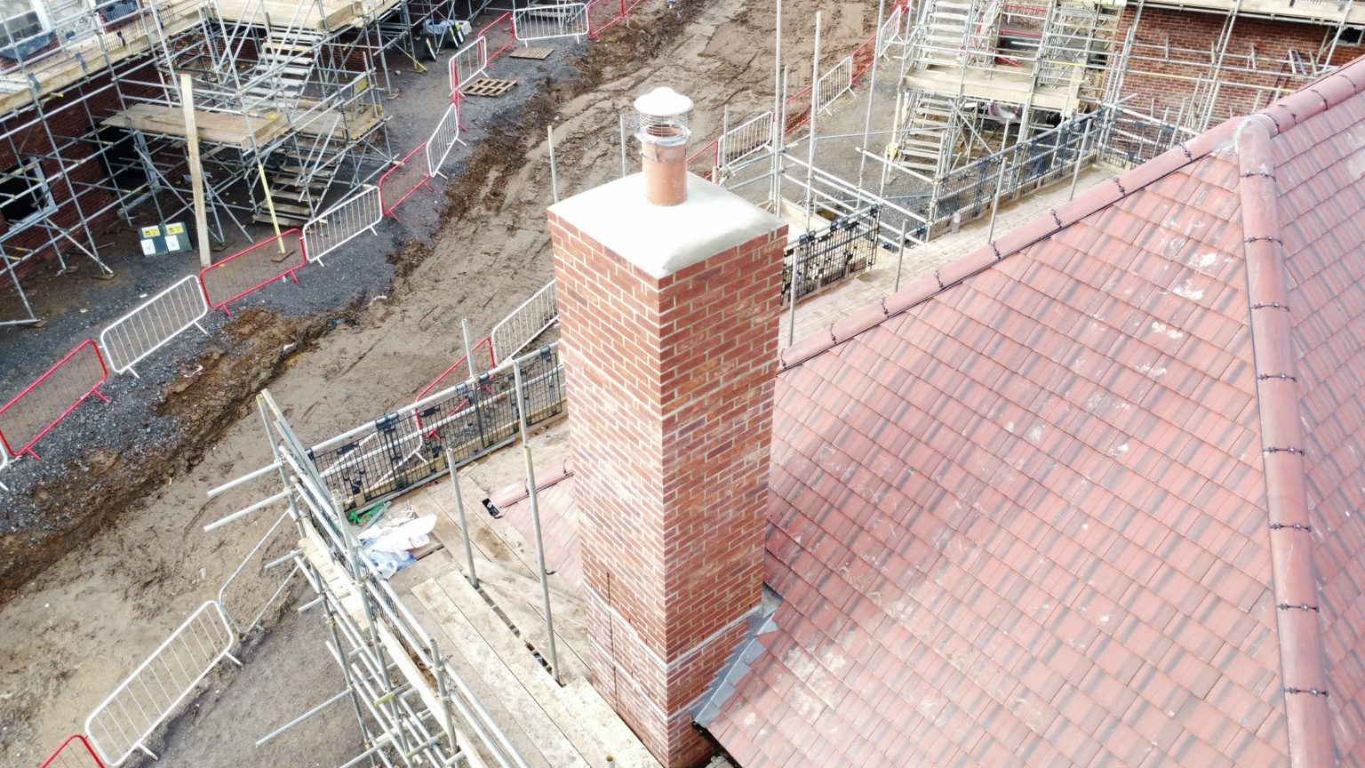 Aerial view of roof tiles and chimney on a new-build home